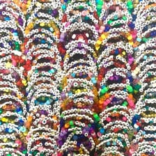 A colorful friendship bracelet made with small beads.