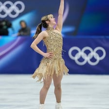 Figure skater Alysa Liu airborne during an axel jump