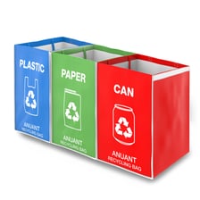 A recycling bin containing recyclable household materials.