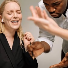 A person signaling surrender during an argument