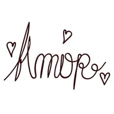 The Spanish word amor displayed with a heart motif