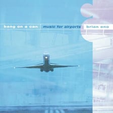 Brian Eno pictured with or alongside the Music for Airports album.