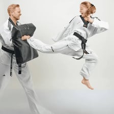 A taekwondo practitioner performing a high kick.