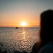 A person pausing to enjoy a beautiful sunset.