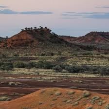 Flat-topped mesas rising from a desert landscape.