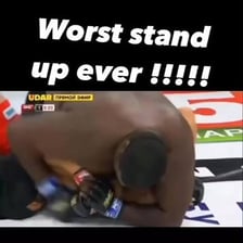 A referee stopping a mixed martial arts fight.