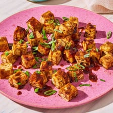 A small appetizing bite of food on a plate