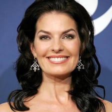 A portrait of actress Sela Ward.