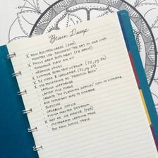 A handwritten list of tasks in a notebook