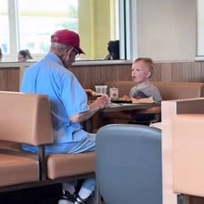 A person looking satisfied after eating a hearty meal