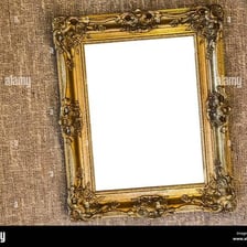 A picture frame hangs at a noticeable angle on a wall.