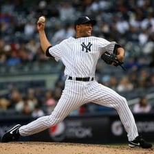 A baseball pitcher throwing a pitch.