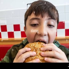 A person taking a bite of food