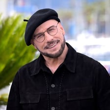 John Travolta wearing a beret at the Cannes Film Festival.