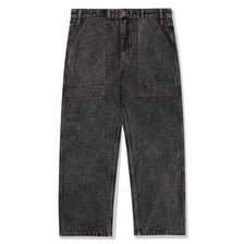 Pair of faded acid-washed denim jeans