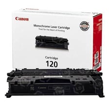 A toner cartridge beside a Canon laser printer