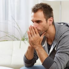 A person displaying an anxious, tense posture