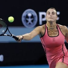 A tennis match being played in a tournament semifinal.
