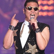 South Korean singer PSY performing onstage.