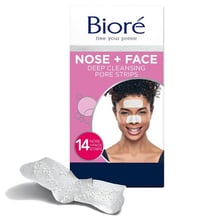 A person wearing a Biore pore strip across the nose.