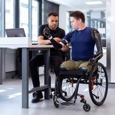 A person using technology made accessible by an enabling feature.