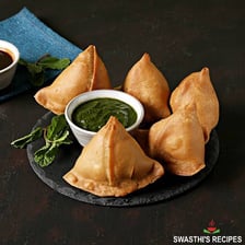 A golden-brown fried samosa.
