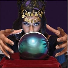A fortune teller gazing into a crystal ball