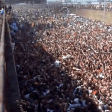 A crowd gathered amid a noisy public commotion.