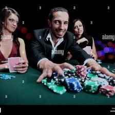 A poker player pushing a stack of chips forward