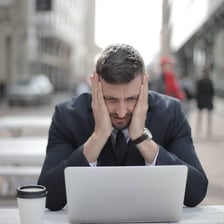 A frustrated person reacting as if ready to complain.