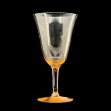 A goblet showing its narrow stem between the bowl and base