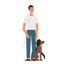 A dog standing faithfully beside its owner
