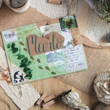 Handwritten correspondence and an envelope representing a pen-pal exchange.
