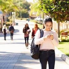 Students walking on a university campus in Britain.