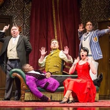 An actor performing a role on a theater stage