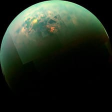 Titan, Saturn’s largest moon, shown against space.