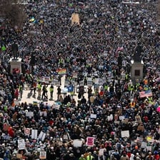 Officials stopping a protest or public disturbance.