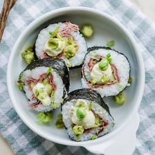 A sliced sushi roll served on a plate