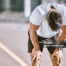 An exhausted person resting after physical exertion