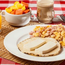 A round arepa, a cornmeal cake common in Colombian and Venezuelan cuisine.