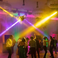A lively party with colorful lights and dancing