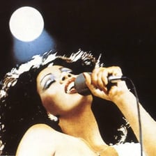 Donna Summer performs onstage during her disco-era career.