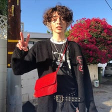 A young man wearing clothing associated with the e-boy online fashion aesthetic