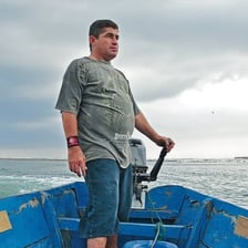 A small boat surrounded by open ocean