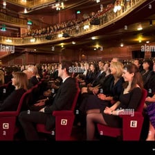 A captivated person watching a performance intently