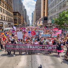 Colorful floats and marchers at a Pride parade