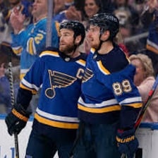 Professional ice hockey players competing in an NHL game.