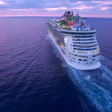 A large cruise ship sailing on open water.
