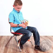 A person fidgeting restlessly while seated