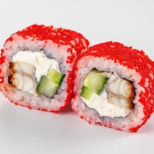 A sushi roll topped with small fish eggs.